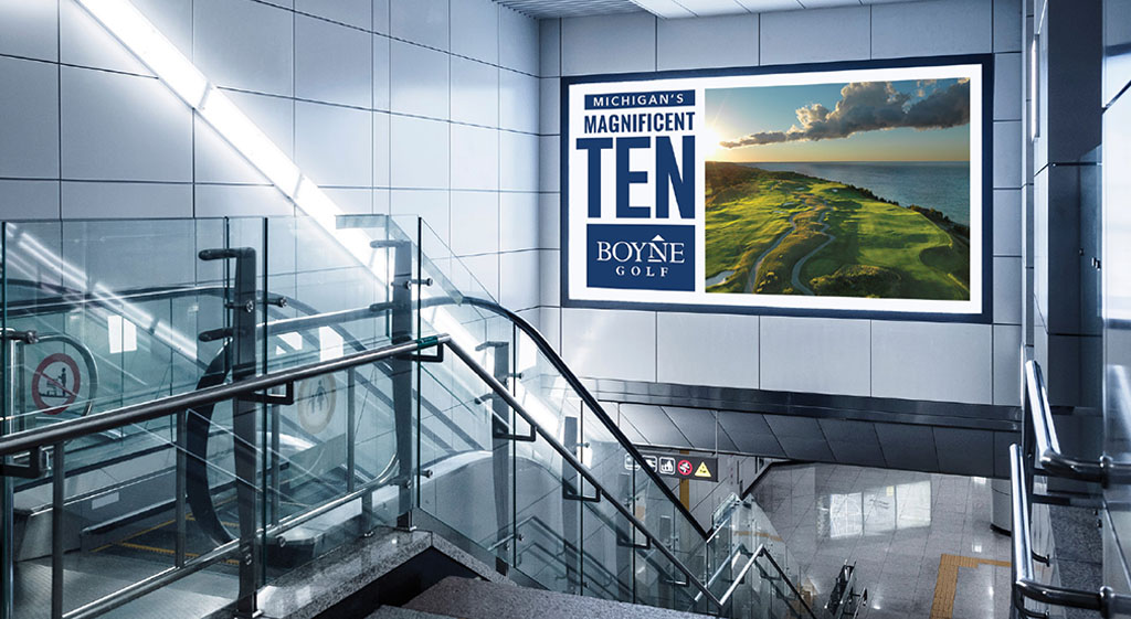 Boyne Golf signage in an airport near the escalator